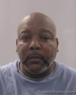 Mugshot of John Junior Evans