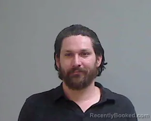 Mugshot of Aaron Martin Caceres