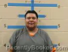 Mugshot of REGGIE JR. CHASE ALONE booked in Oglala Lakota County, South Dakota on May 4, 2026