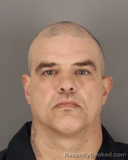 Mugshot of JUSTIN MOORE