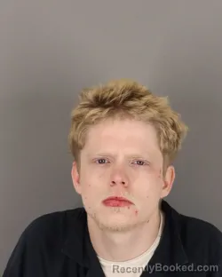 Mugshot of JUSTIN THEDY