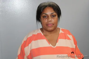 Mugshot of KENYA DIONE TOLSON booked in Madison County, Texas on April 22, 2026