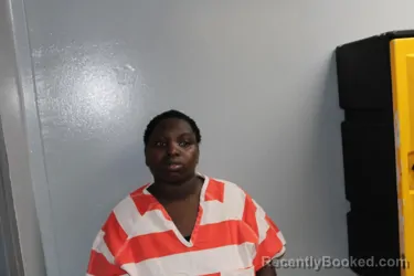 Mugshot of ESTHER AWINO OGWENO booked in Madison County, Texas on May 10, 2026