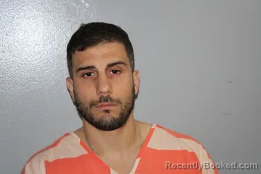 Mugshot of FERHAT TOPCU booked in Madison County, Texas on June 12, 2026