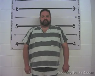 Mugshot of JONATHAN RAYMOND FENOGLIO booked in Montague County, Texas on April 24, 2026