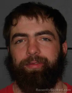 Mugshot of JUSTIN ALLEN RAYMOND