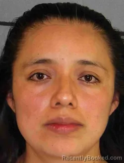 Mugshot of DULCE BRAVO booked in Moore County, Texas on May 7, 2026