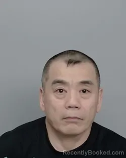 Mugshot of Dun Hu booked in Nueces County, Texas on July 23, 2026