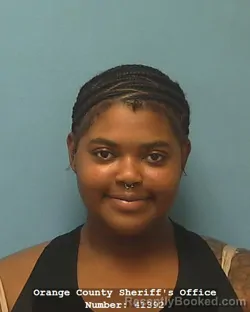 Mugshot of JOHNNISEIA KIMBREANNA MCGHEE booked in Orange County, Texas on May 27, 2026