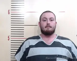 Mugshot of Travis Owen Tolson booked in Parker County, Texas on March 19, 2026