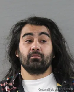 Mugshot of NICHOLAS IKAIKA SIMS-GALBISO