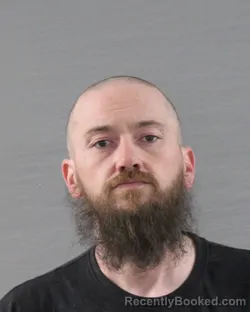 Mugshot of DUSTIN BLAKE QUEBEDEAUX