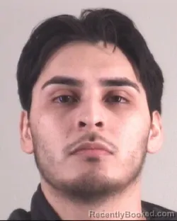 Mugshot of JUSTIN ALVAREZ