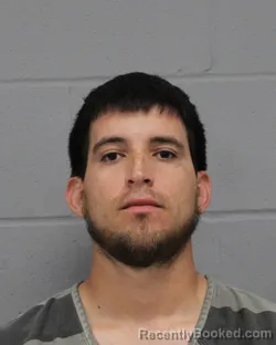 Mugshot of JESUS REYES booked in Travis County, Texas on March 24, 2026