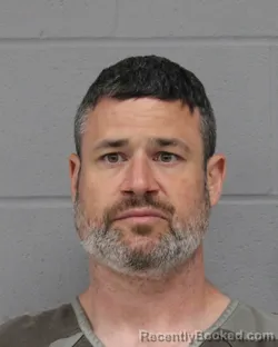 Mugshot of JUSTIN SMITH booked in Travis County, Texas on March 24, 2026