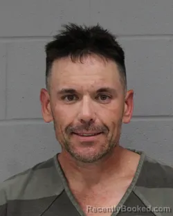 Mugshot of JUSTIN WHARTON booked in Travis County, Texas on March 24, 2026