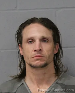 Mugshot of ADAM MCCLENDON booked in Travis County, Texas on March 31, 2026