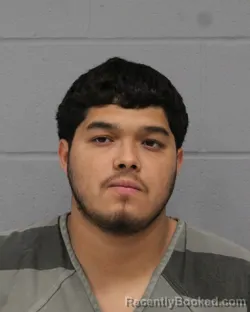 Mugshot of ISAIAS CUADROS booked in Travis County, Texas on April 20, 2026