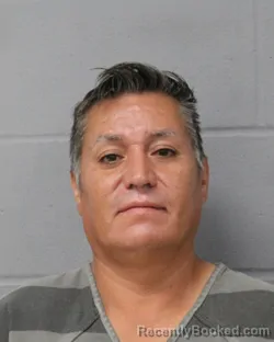 Mugshot of JUAN SANJUAN ALVARADO booked in Travis County, Texas on April 21, 2026