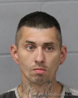 Mugshot of TRAVIS BELL booked in Travis County, Texas on April 24, 2026