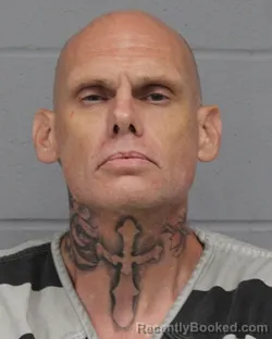 Mugshot of DARIN BARCUS booked in Travis County, Texas on June 14, 2026