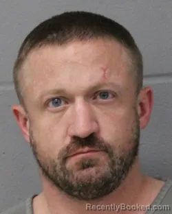 Mugshot of ERIC FOSTER booked in Travis County, Texas on June 14, 2026