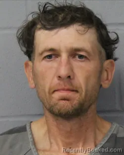 Mugshot of ROMAN KOZAK booked in Travis County, Texas on June 15, 2026