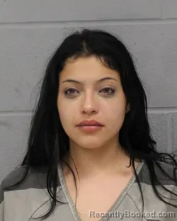 Mugshot of KATE MONZANARES booked in Travis County, Texas on June 23, 2026