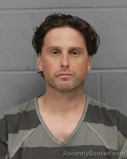 Mugshot of GARRETT MASON booked in Travis County, Texas on June 24, 2026