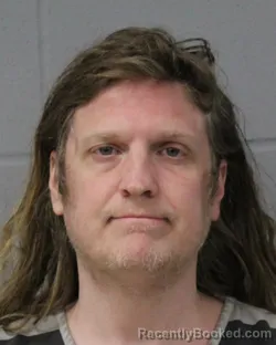 Mugshot of COLE KNAPEK booked in Travis County, Texas on June 24, 2026