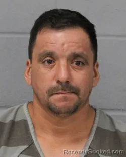 Mugshot of Omar Alfredo booked in Travis County, Texas on July 27, 2026