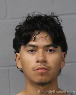 Mugshot of Carlos Delarosa booked in Travis County, Texas on July 28, 2026