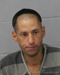 Mugshot of John Zamora booked in Travis County, Texas on August 4, 2026