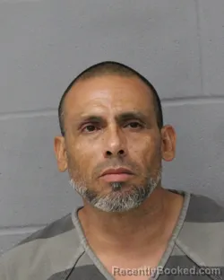 Mugshot of Juan Reyes booked in Travis County, Texas on August 4, 2026