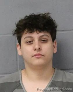 Mugshot of Yahir Madrigal booked in Travis County, Texas on August 7, 2026