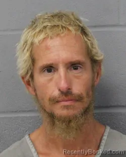 Mugshot of Justin Groll booked in Travis County, Texas on September 22, 2026