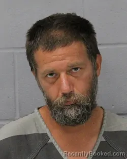 Mugshot of John Howard booked in Travis County, Texas on September 25, 2026