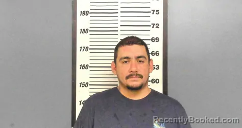 Mugshot of ISAAC OMAR ROMO booked in Willacy County, Texas on May 10, 2026