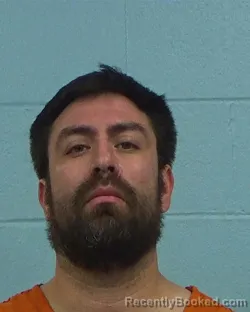 Mugshot of Alan Couoh