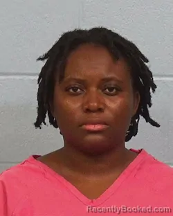 Mugshot of Romance Tresor Nembila booked in Williamson County, Texas on March 12, 2026