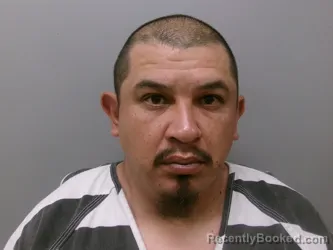 Mugshot of JOHN ROLAND GUZMAN booked in Wise County, Texas on March 22, 2026