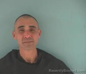 Mugshot of ENRIQUE URBINA booked in Okeechobee County, Florida on March 28, 2026