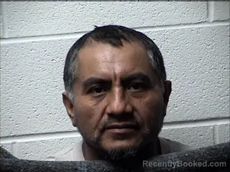 Mugshot of OLGER JESUS MARROQUIN-RAMIREZ