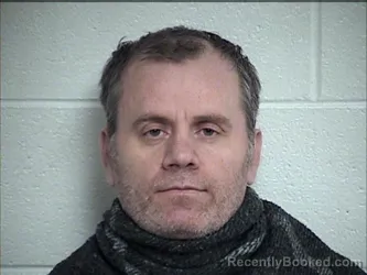 Mugshot of DHIONIS ZHIDRO booked in Chase County, Kansas on March 19, 2026