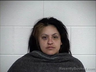 Mugshot of FLORA ELVIRA DE LA CRUZ BUSTILLOS booked in Chase County, Kansas on May 9, 2026