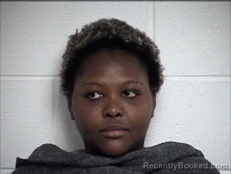 Mugshot of CAROLINE WANJIRU GUCHU booked in Chase County, Kansas on May 9, 2026