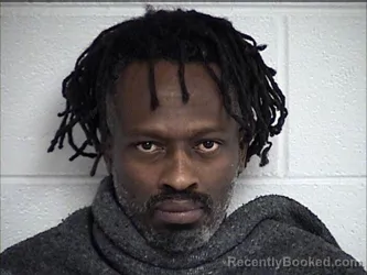 Mugshot of ALEX MWAURA KARANU booked in Chase County, Kansas on August 1, 2026