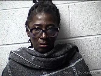Mugshot of ETHEL BELLA TITANG EPSE NJUAKOM booked in Chase County, Kansas on August 3, 2026