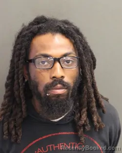 Mugshot of QAHIR ODE ALI COYETT