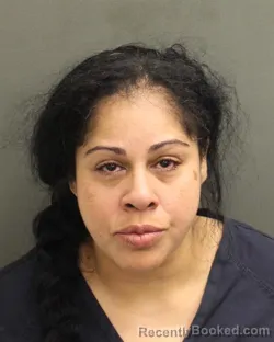Mugshot of ALFY TERESA NEGRON booked in Orange County, Florida on April 15, 2026